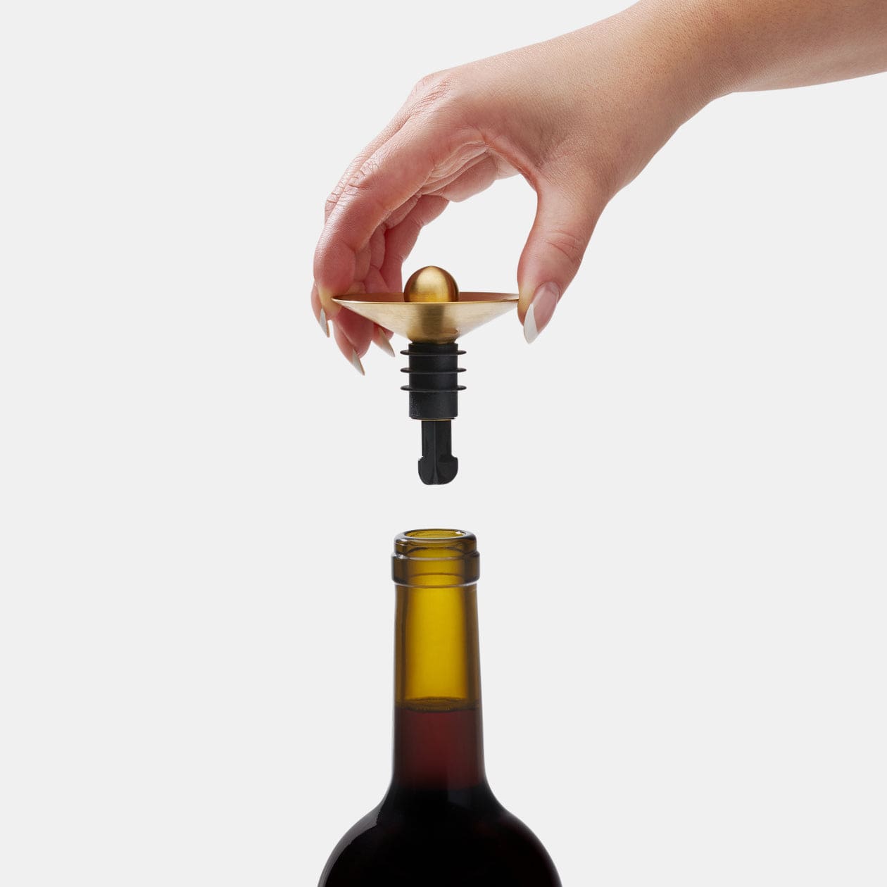 RBT Wine Pourer Stopper being placed into a wine bottle.